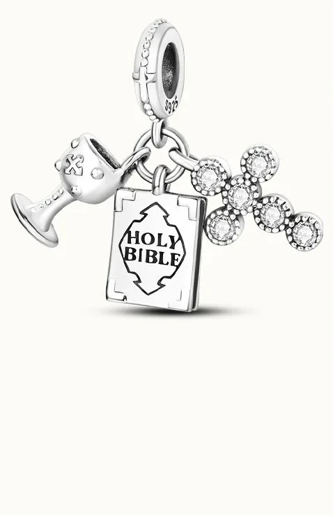Silver jewelry charms with 'HOLY BIBLE' text 