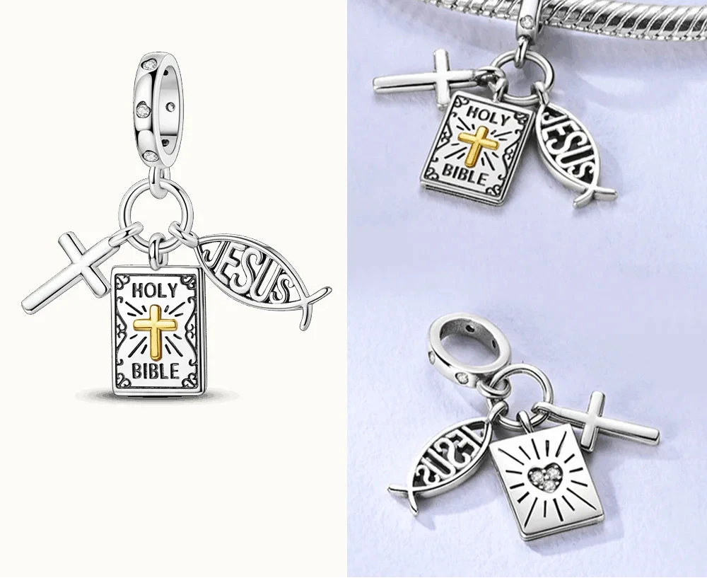 Silver charms with religious symbols on a white background, 
