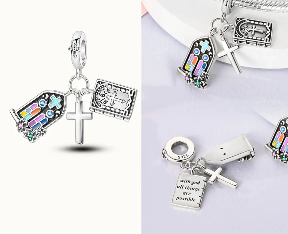 Collection of silver charms with religious symbols on a white background, 